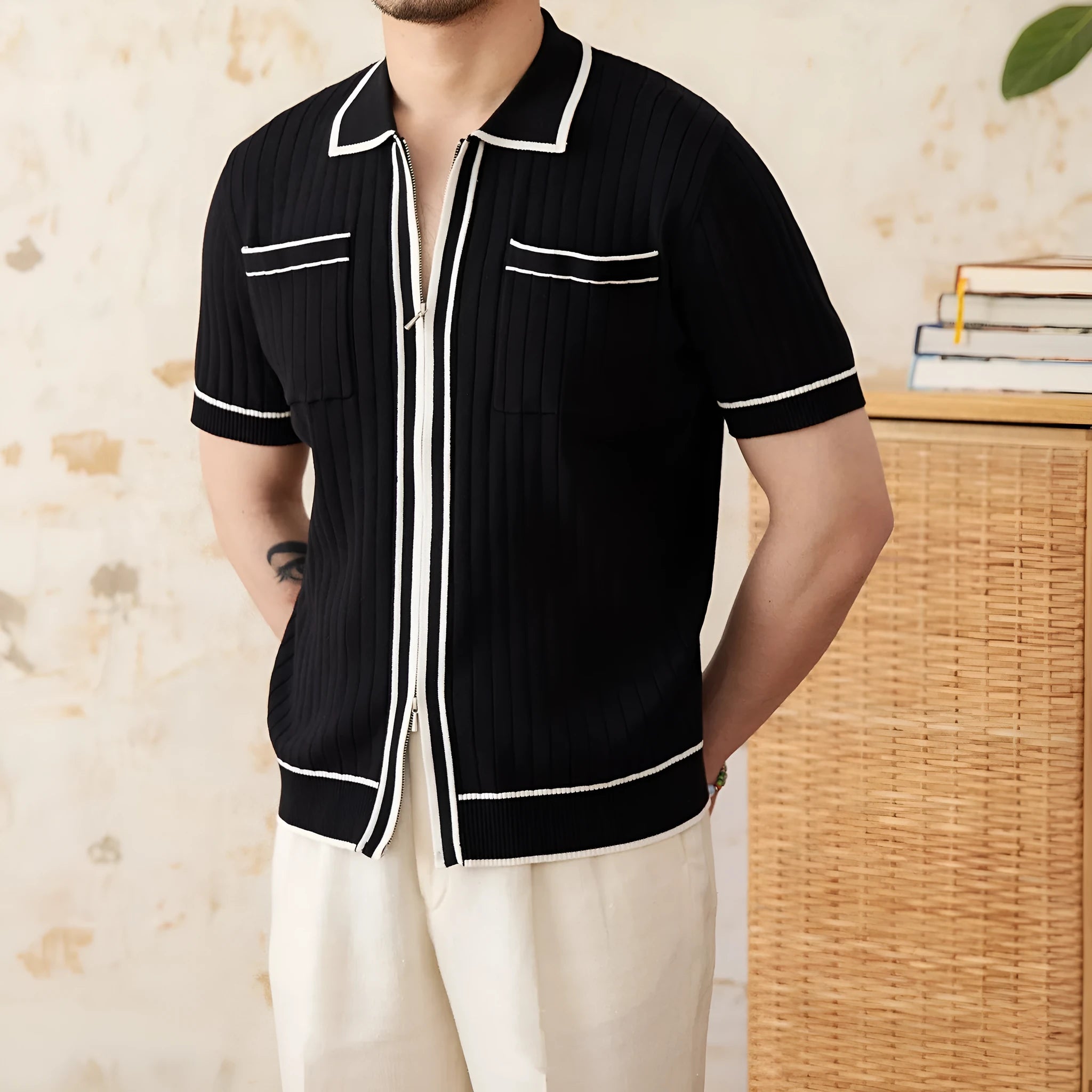 A man's slim-fit short-sleeved polo shirt with a lapel collar, shown in black and white.