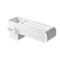 White plastic freestanding kitchen knife rack on a countertop.