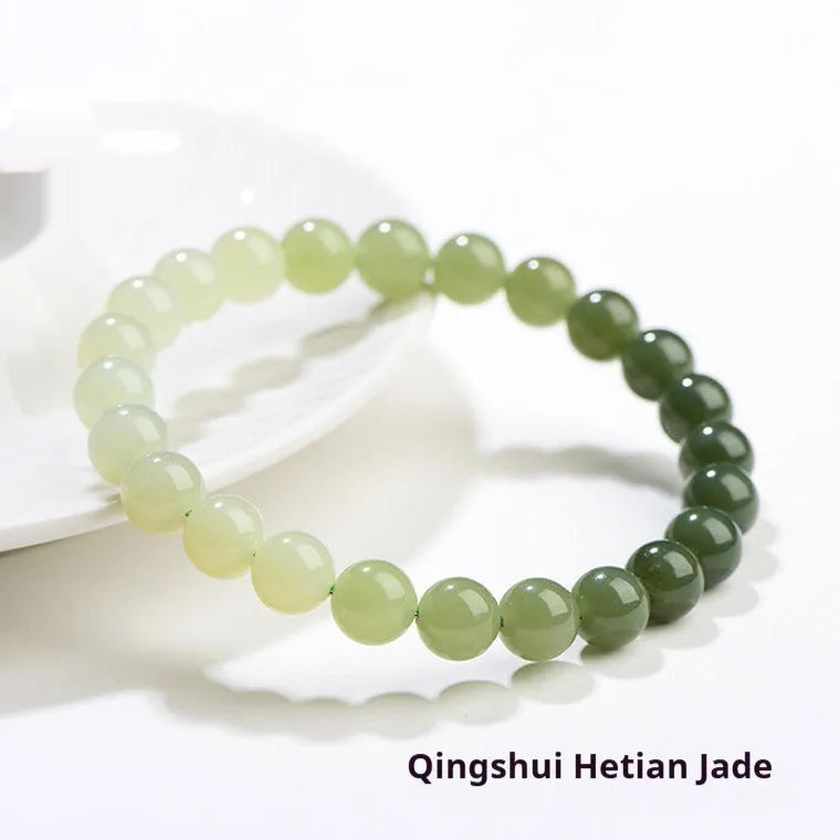 Natural clear water Hetian jade bracelet with gradient colour beads in round or barrel styles.
