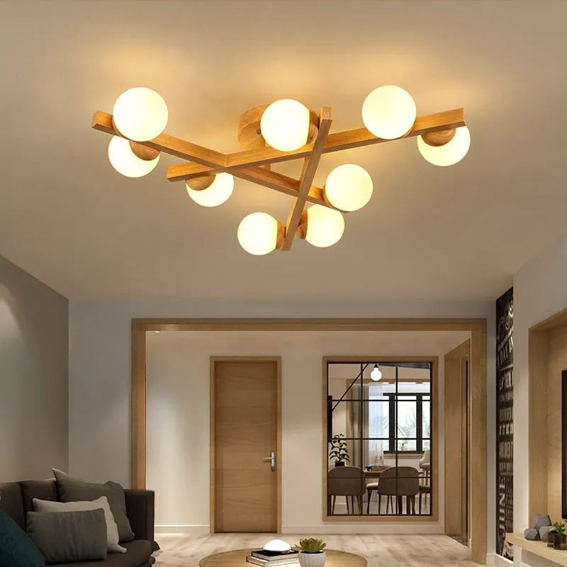 Wooden style modern Nordic ceiling light with three heads, installed in a living room.