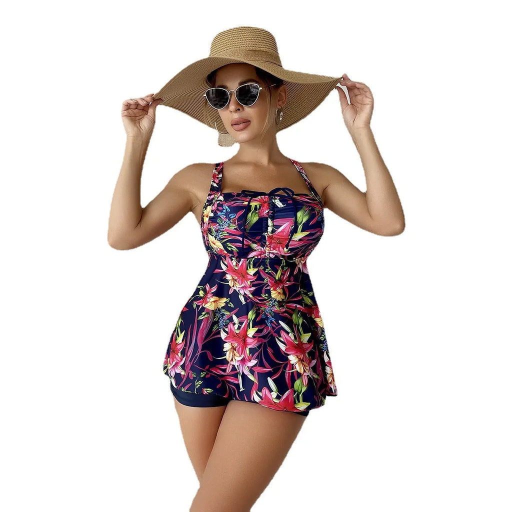 Female skirt-style tangini swimsuit with high waist, backless design and floral print.