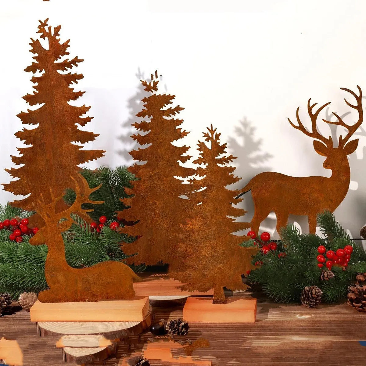 Set of three rusty iron Christmas tree decorations with standing elk figures