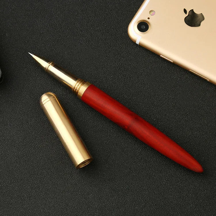 Brass sandalwood signature pen with wood grain visible on 14cm long writing instrument