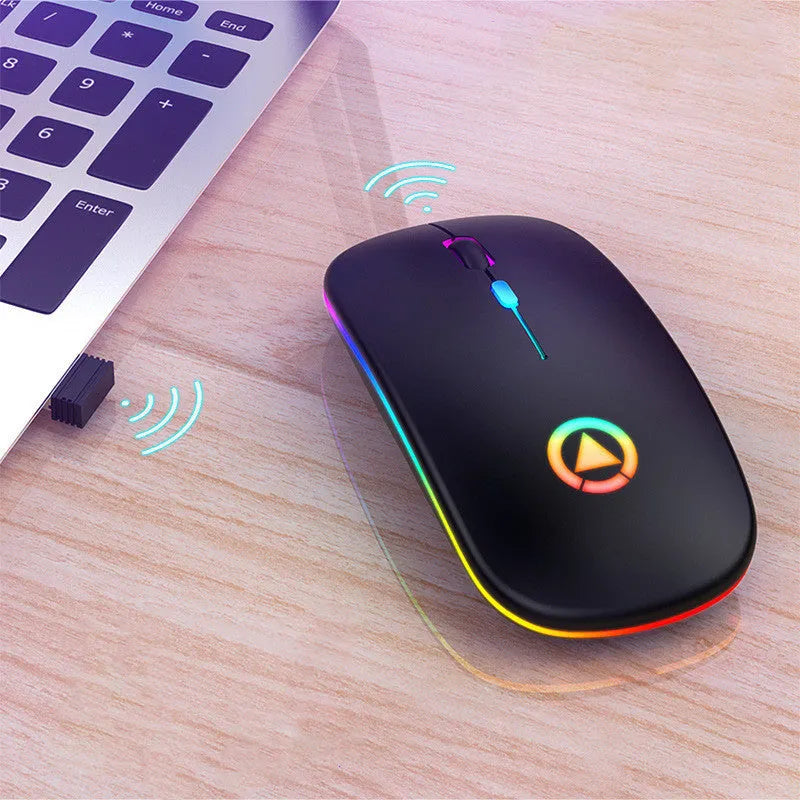 Ultra-thin mini wireless mouse in metallic grey with colourful breathing glow on a desk