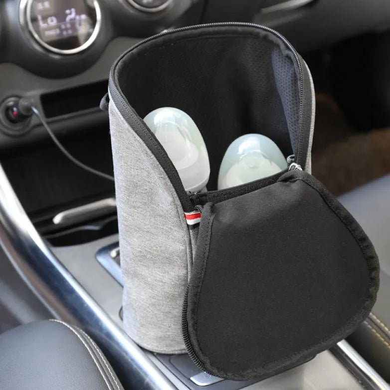 Grey Oxford cloth portable car USB baby bottle warmer with electronic display and car charger.