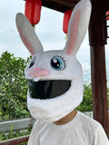 White rabbit plush helmet cover for electric motorcycle with long ears.