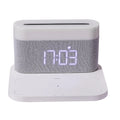 White or black table lamp with integrated wireless phone charger and digital clock display