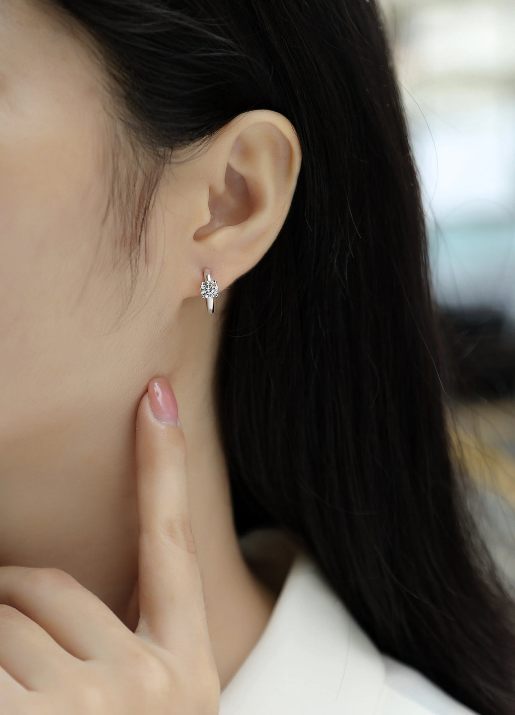 0.5-carat top-quality moissanite stud earrings in S925 silver with platinum plating on white background