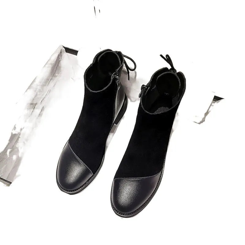 Black women's above-the-knee Martin boots with a side zipper, round toe, and decorative bow.