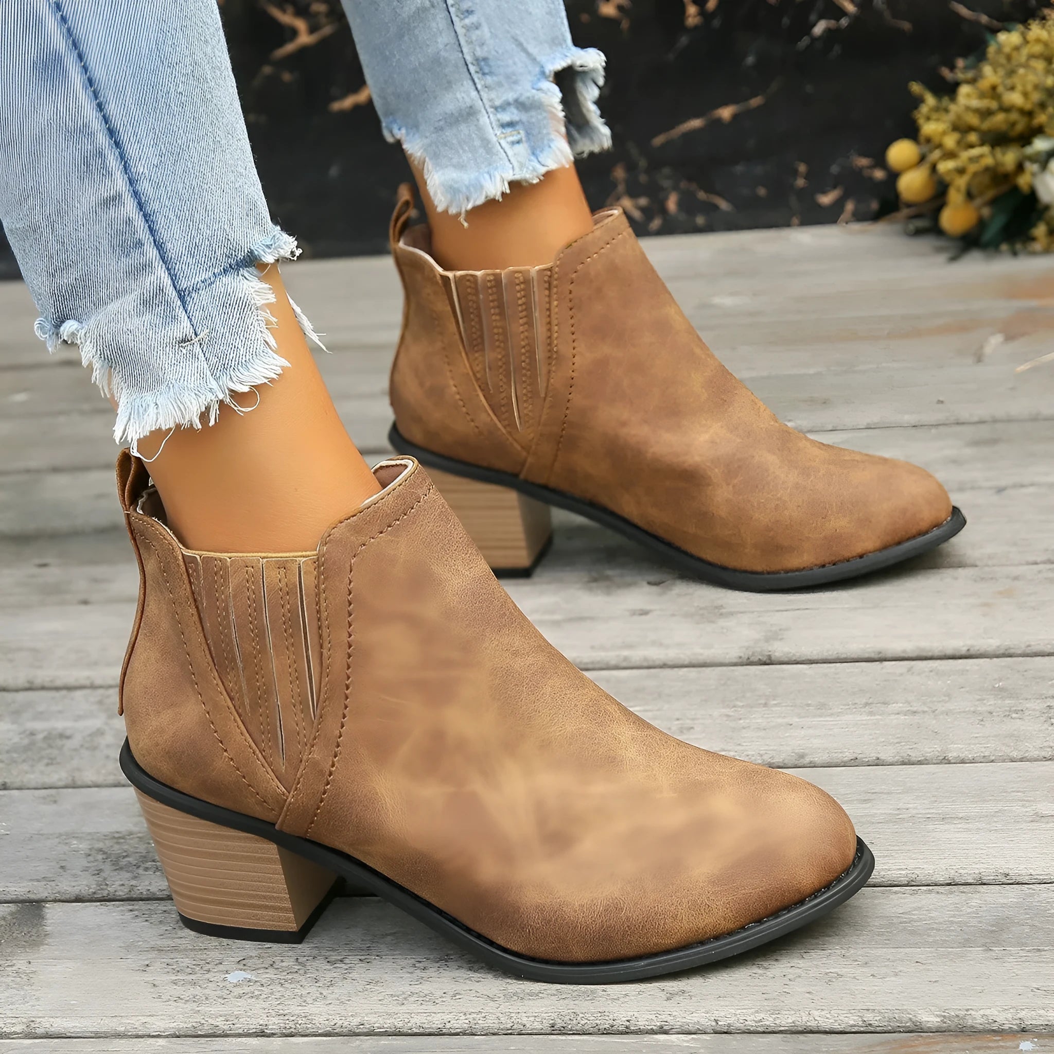Women's black pointed toe ankle boots with thick square heel, slip-on design