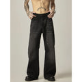 Black loose-fit straight-leg retro jeans with zipper fly on a plain background.