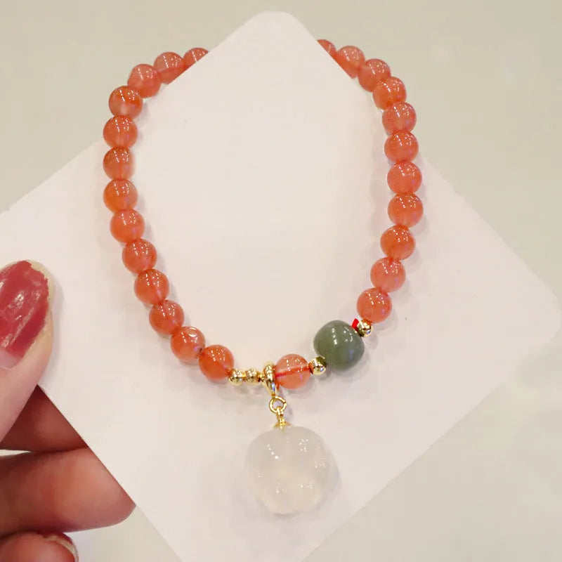 8mm natural red agate bracelet with jade inlay and cat paw animal charm