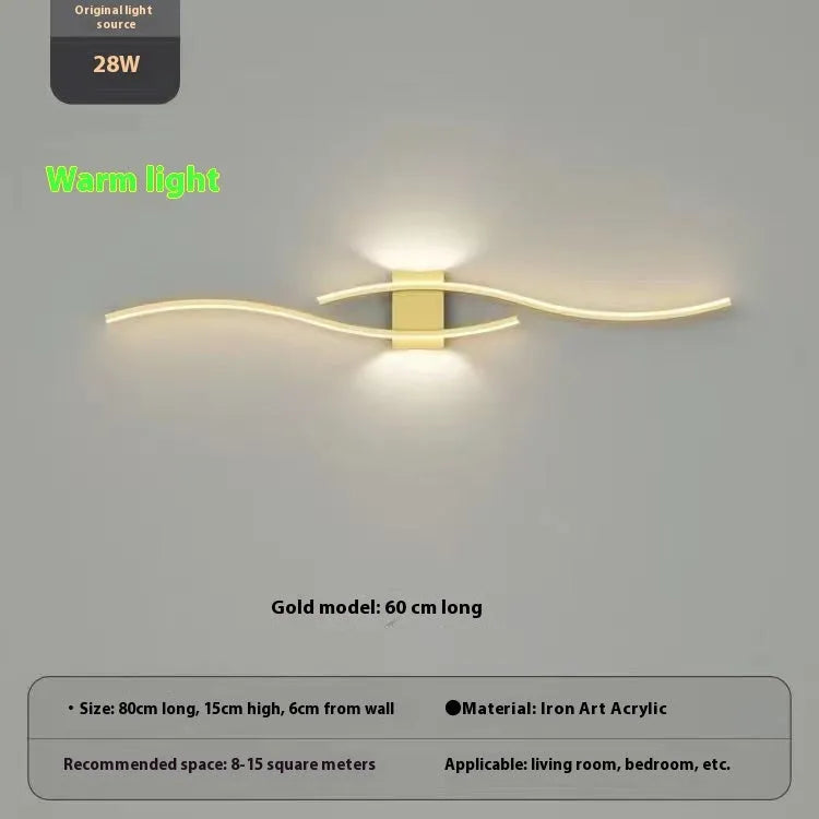 Black 60cm bedside wall lamp with acrylic panel and wrought iron frame on neutral wall