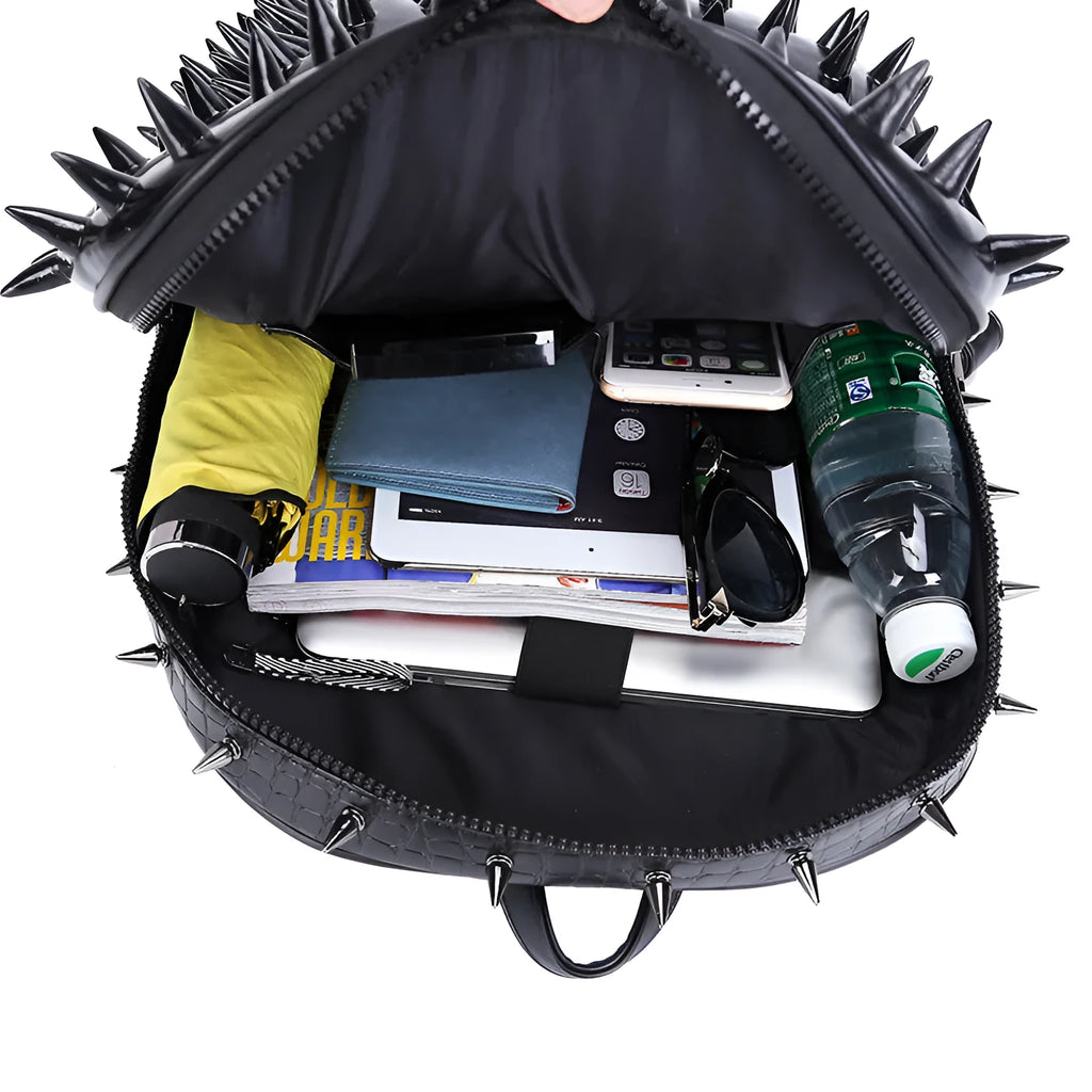 Women's oval black punk rock style travel backpack with hollow-out details and air cushion straps.