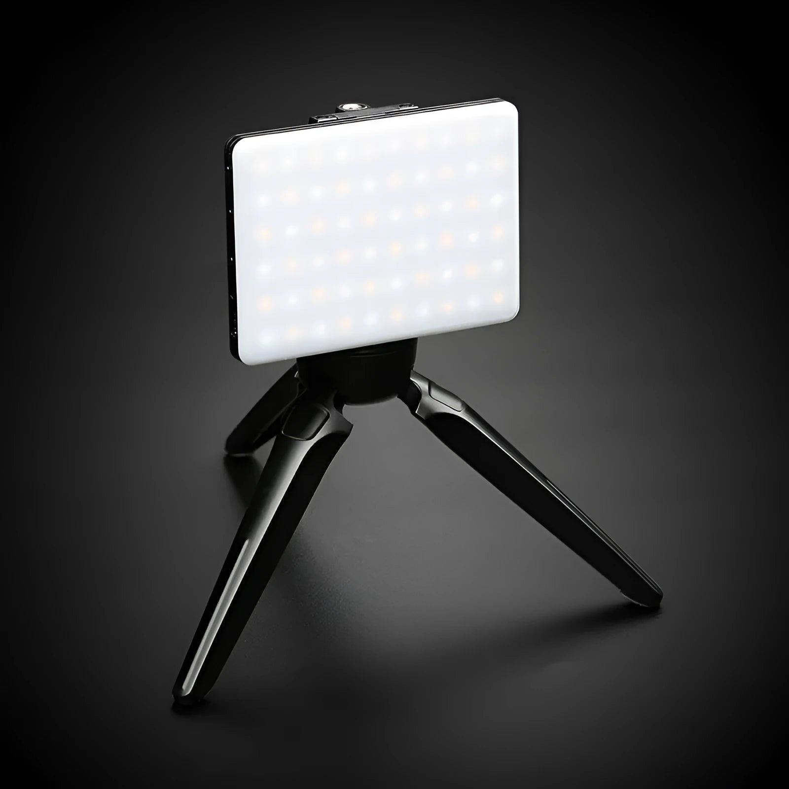 Compact white mobile phone fill light with adjustable head and mounting clips for video calls