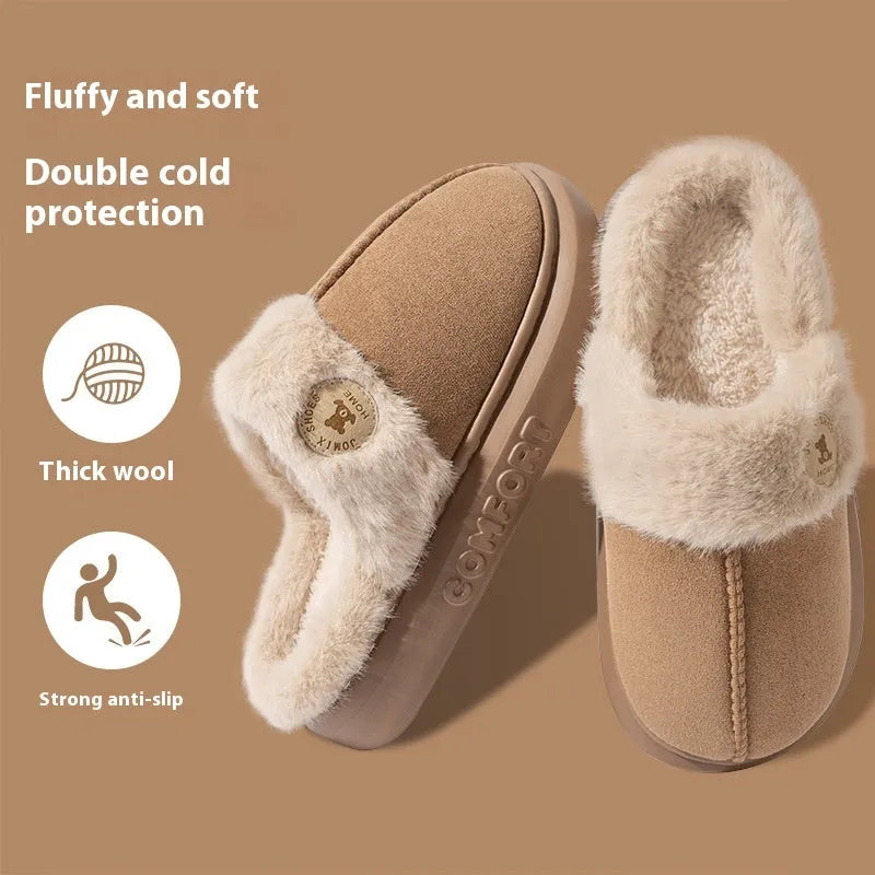 Pair of thick-soled fleece indoor slippers in a chosen colour, showing car stitching detail on the upper.