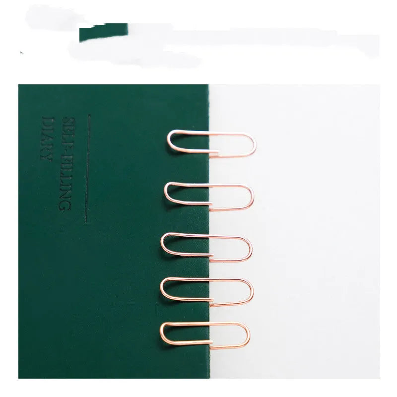 Rose gold heart-shaped metal paper clips, 28mm size, shown in a pack of 100.