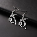 Pair of stainless steel hummingbird earrings with hollow openwork design, available in gold or steel colour