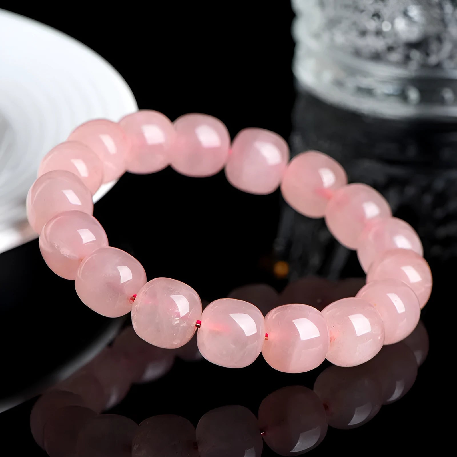 Natural crystal barrel bead bracelet with pink geometry beads measuring 8-10mm