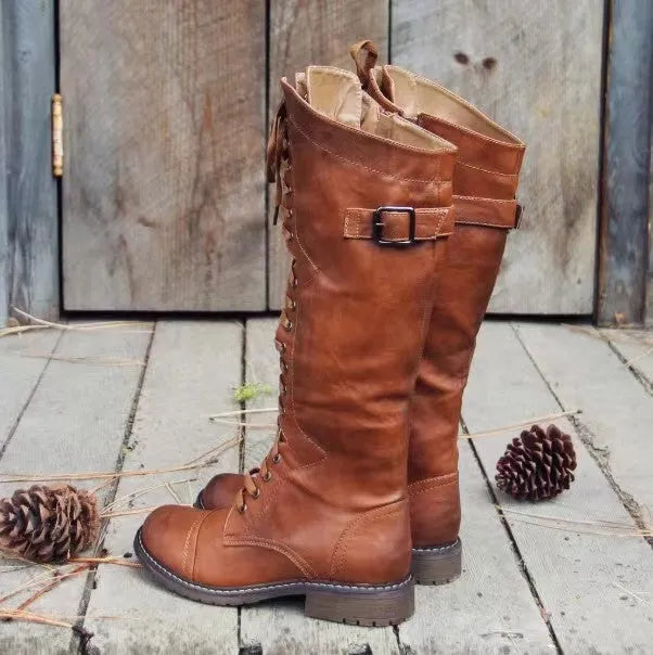 Black chunky heel high-leg casual boot with round toe and low rubber sole on a plain background.