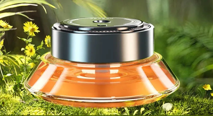 Refillable smart spray car air freshener diffuser in black or green with separate 50ml fragrance bottles.