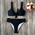 Women's polyester bikini swimwear set in black, pink, red, white, or wine red with bra and briefs