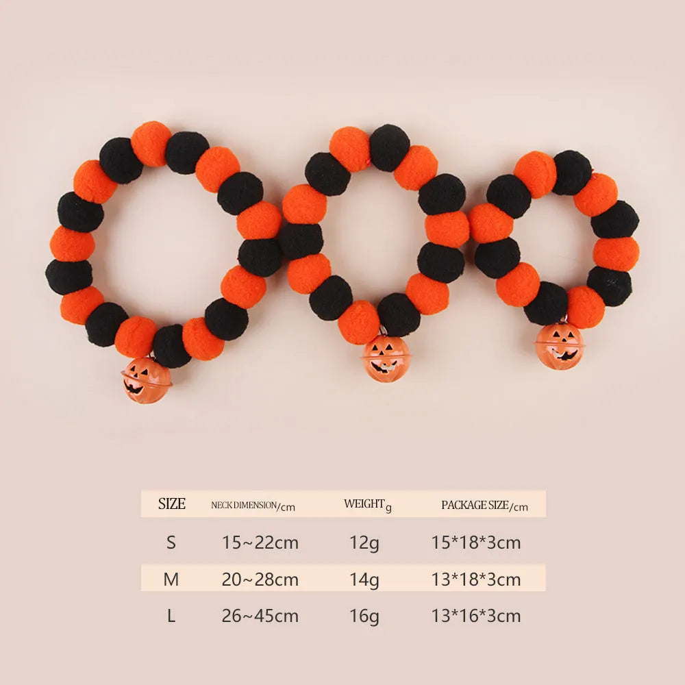 Orange cat collar with a black Halloween pumpkin print and 'trick or treat' text, shown with a buckle.
