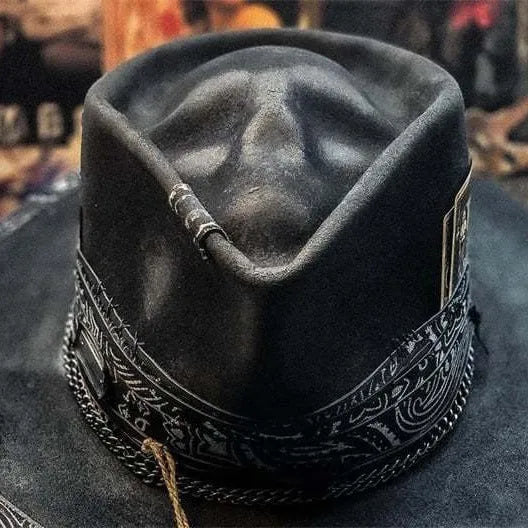 Handmade wool felt skull hat with a conical crown on a model, monochrome print.