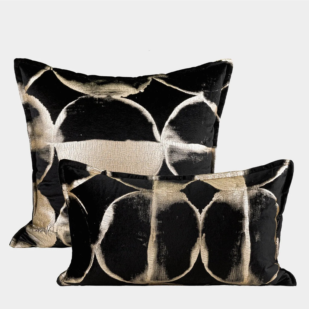 Black gold abstract pattern decorative cushion with removable cover in 45x45cm square size on a grey sofa.