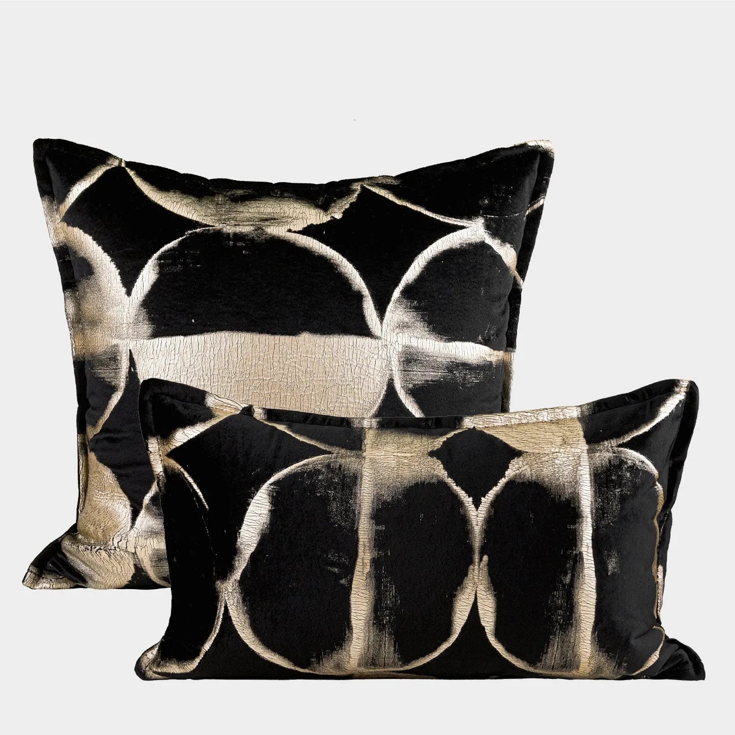 Black gold abstract pattern decorative cushion with removable cover in 45x45cm square size on a grey sofa.