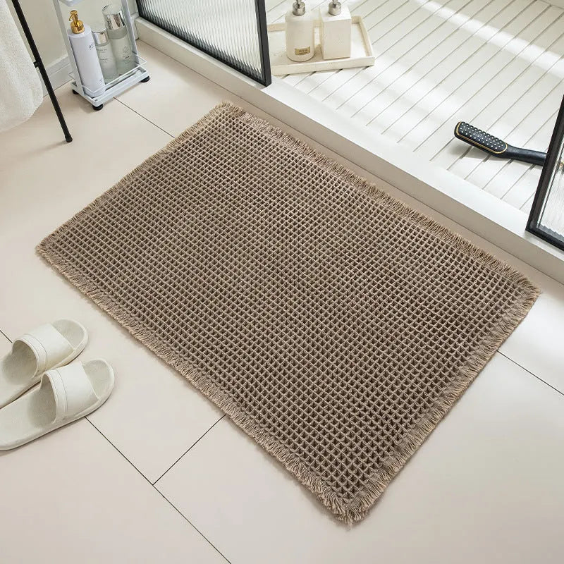 Checkered non-slip bathroom floor carpet in beige, available in multiple sizes from 43x61cm to 61x183cm