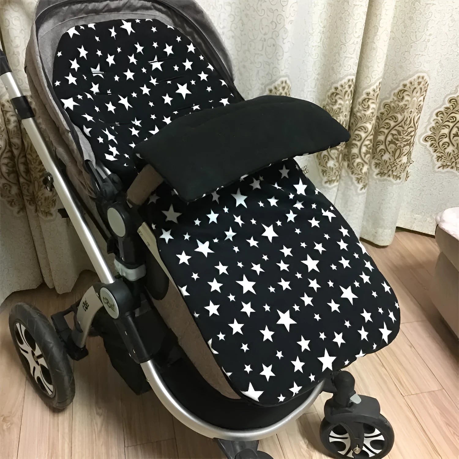 Envelope-style baby stroller sleeping bag in a plain colour, shown on a pram with lamb cashmere lining visible.