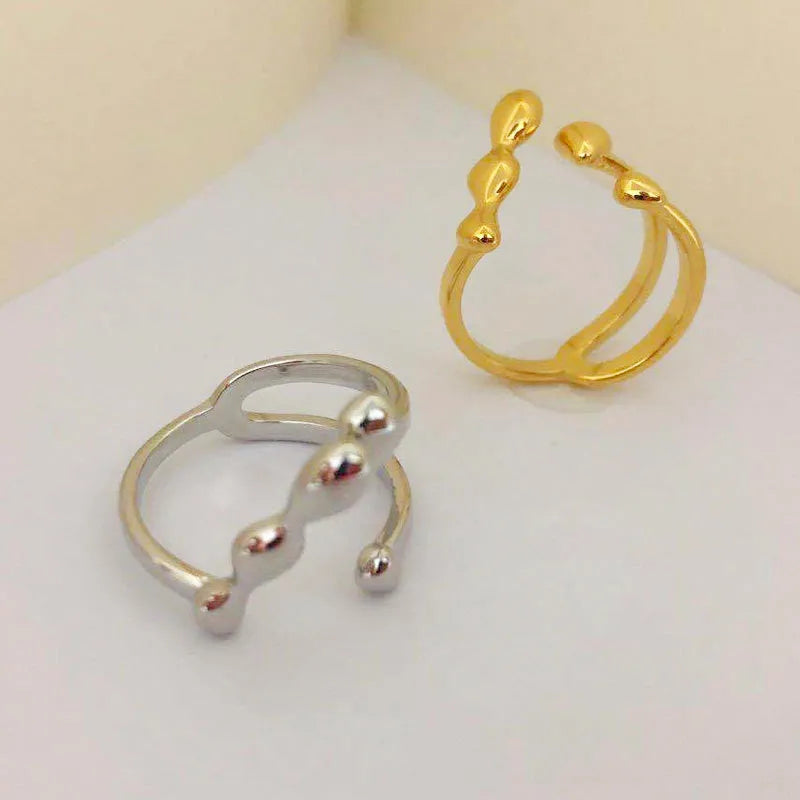 Brass opening ring with spherical design in gold or silver colour options