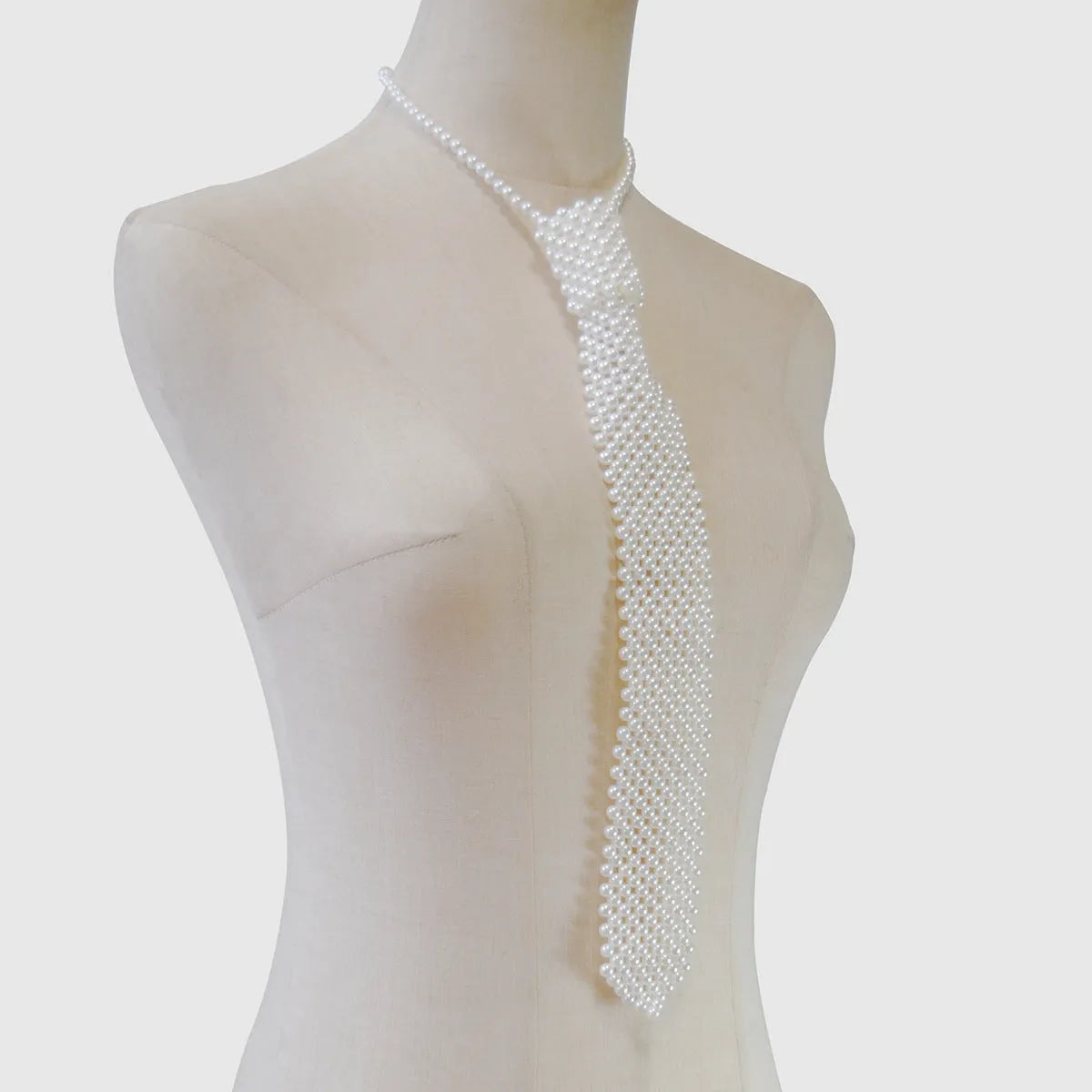 Women's pearl tie body chain jewellery with hollow-out design and alloy fastening