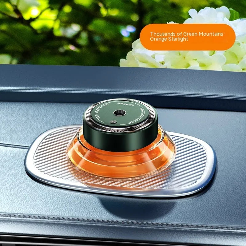 Refillable smart spray car air freshener diffuser in black or green with separate 50ml fragrance bottles.