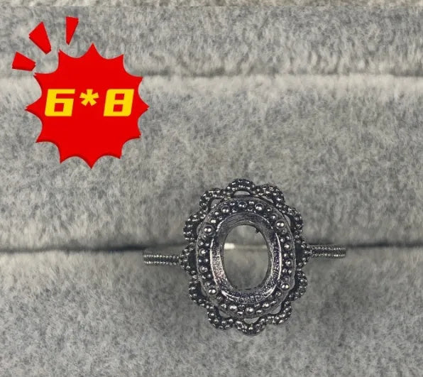 Oval denier ring with 6x8 mm stone and five-pointed star accent on open mouth copper band