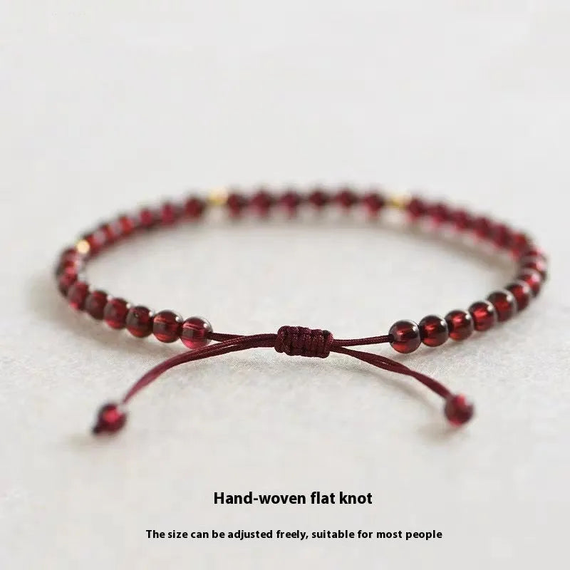Hand-woven garnet red rope Chinese bracelet with flexible wire construction