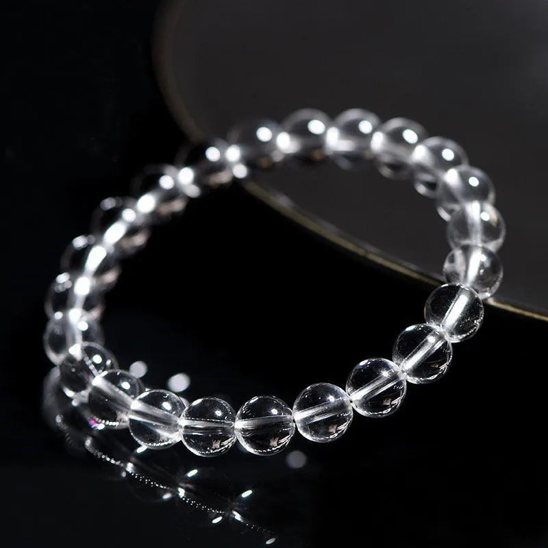 Natural white crystal bracelet with Donghai water round beads showing geometry design on wrist