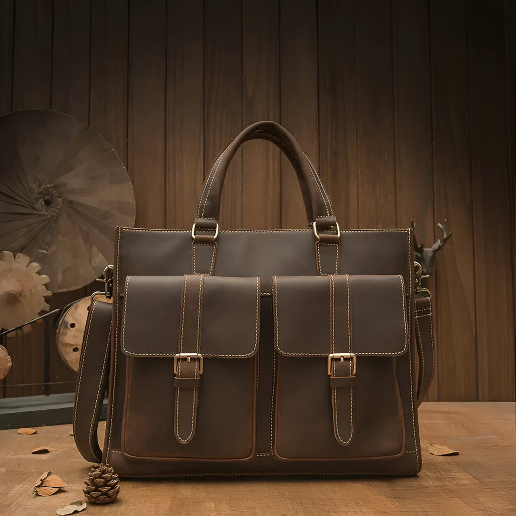 Handmade dark brown leather men's briefcase with top layer cowhide texture holding a 15-inch notebook and folder
