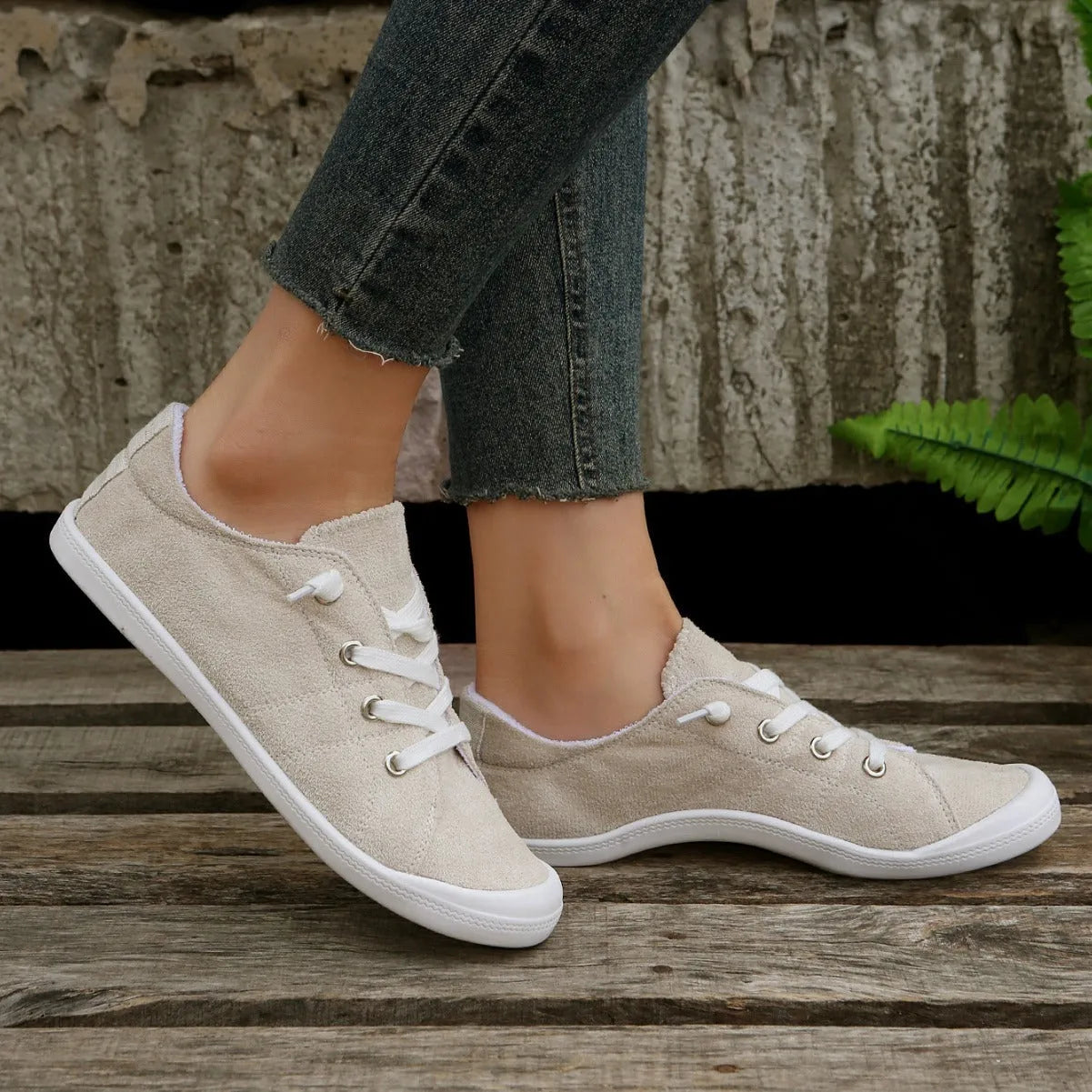 Women's creamy white casual sneakers with soft fabric upper and rubber sole