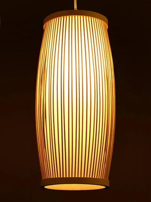 Natural bamboo wall light fixture with a woven shade, measuring 15cm wide and 35cm tall.