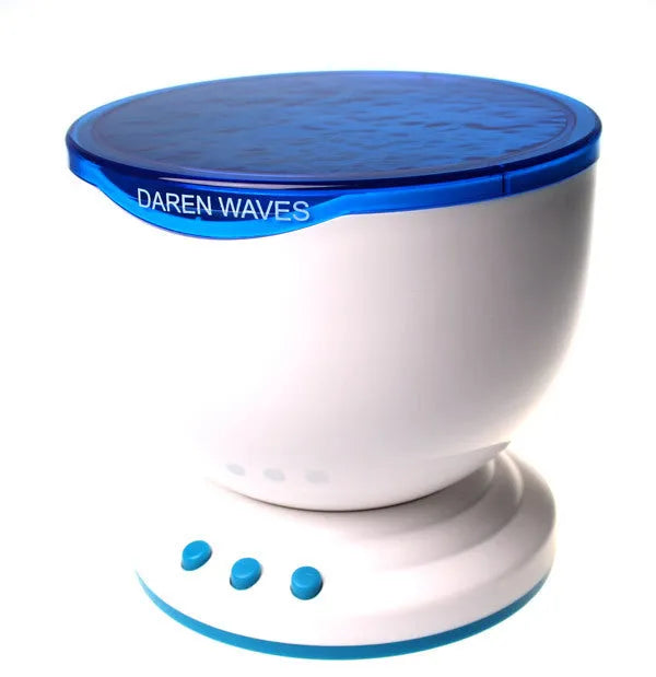 Blue coloured ocean-themed LED projection lamp on a surface for children's puzzle activities.