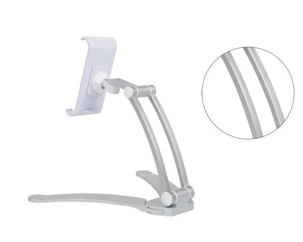 Silver aluminium alloy desktop stand holding a tablet at an angle, with adjustable clips and a white mounting base.