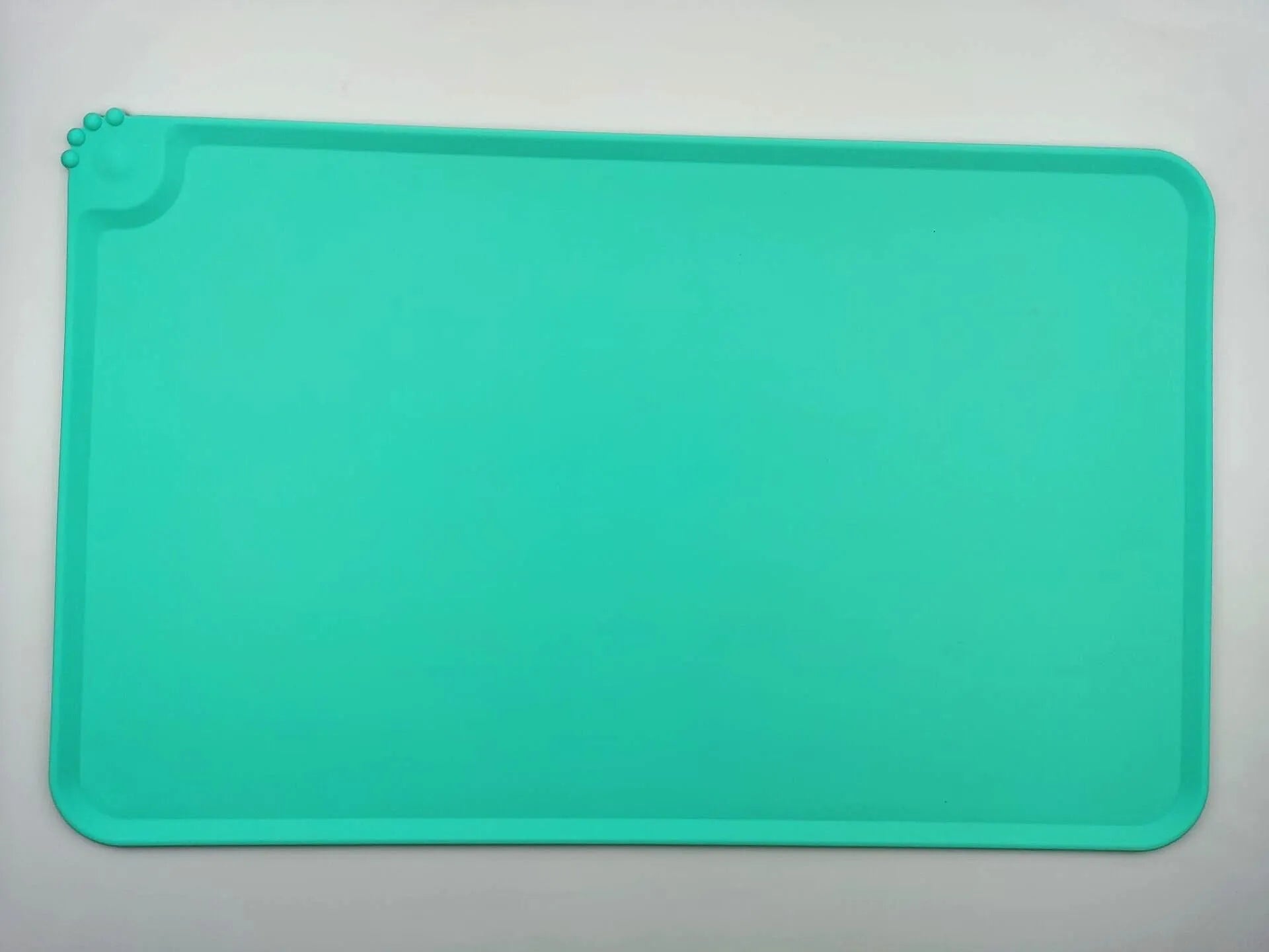 Silicone pet placemat under dog and cat food bowls in multiple colours and sizes