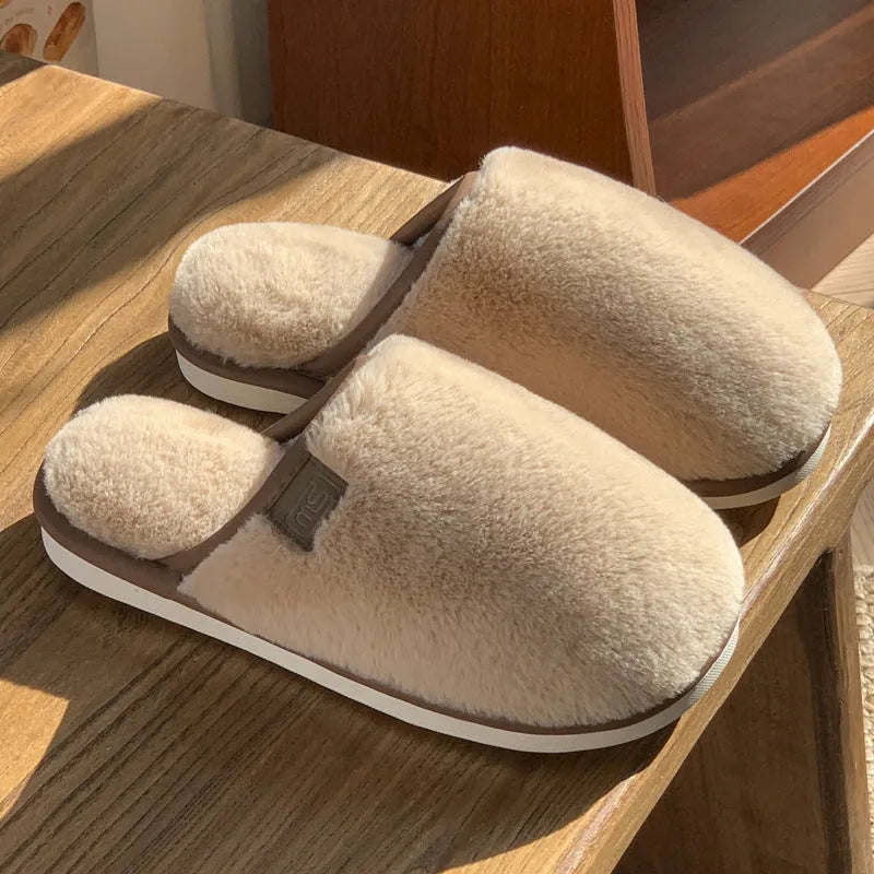 Blue unisex winter plush PVC house slippers with car stitching and a non-slip sole.