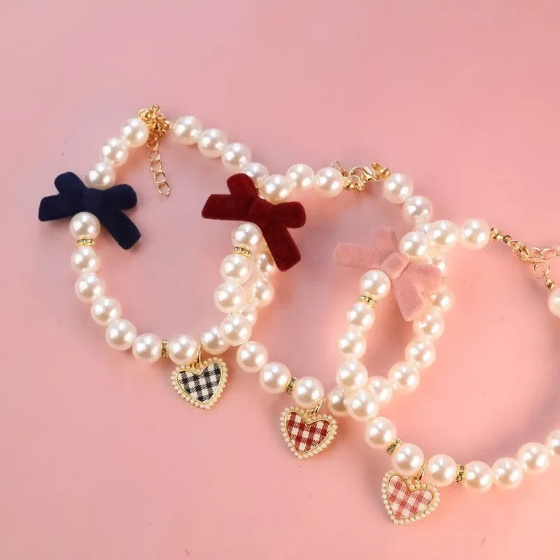 Plastic pet necklace bow tie in plaid black for dogs and cats with retro texture