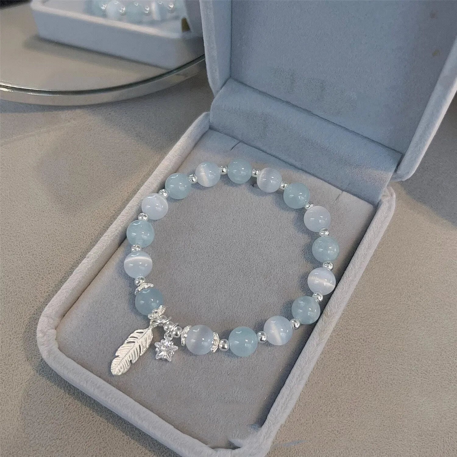 Crystal bracelet with Korean style design featuring letters text in blue moonlight colour