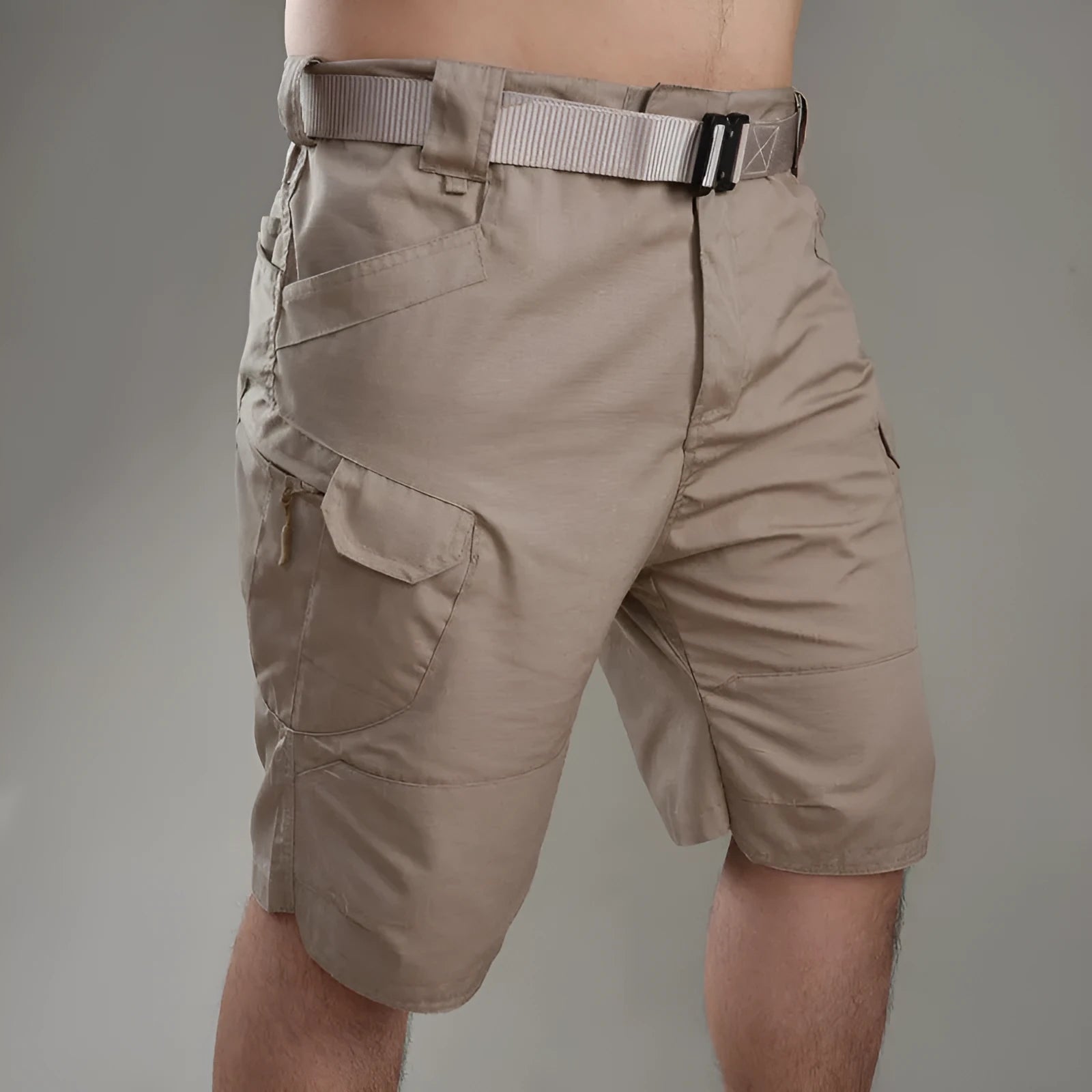 Khaki coloured tactical shorts made from cotton blend fabric on a mannequin.