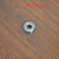 6000z carbon steel ball bearing showing 10mm bore, 26mm outer diameter, 8mm width, and iron cage.