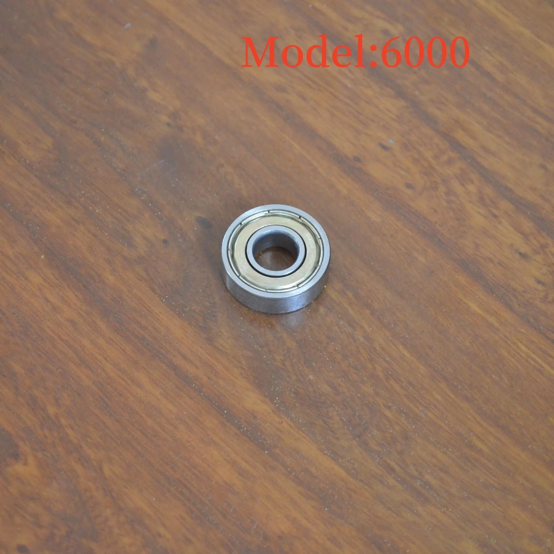 6000z carbon steel ball bearing showing 10mm bore, 26mm outer diameter, 8mm width, and iron cage.